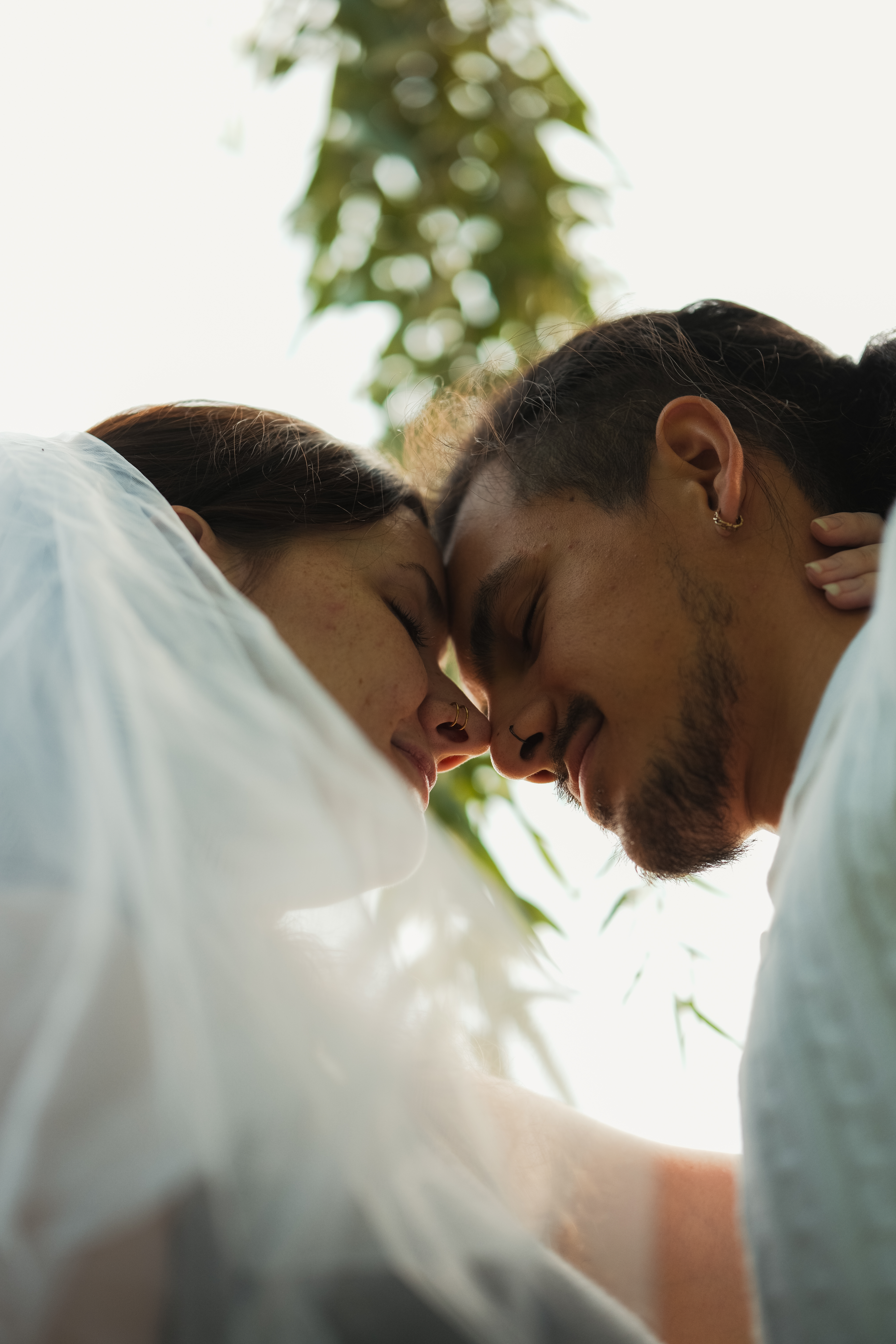 Couple sharing an intimate embrace during an elopement-style celebration
